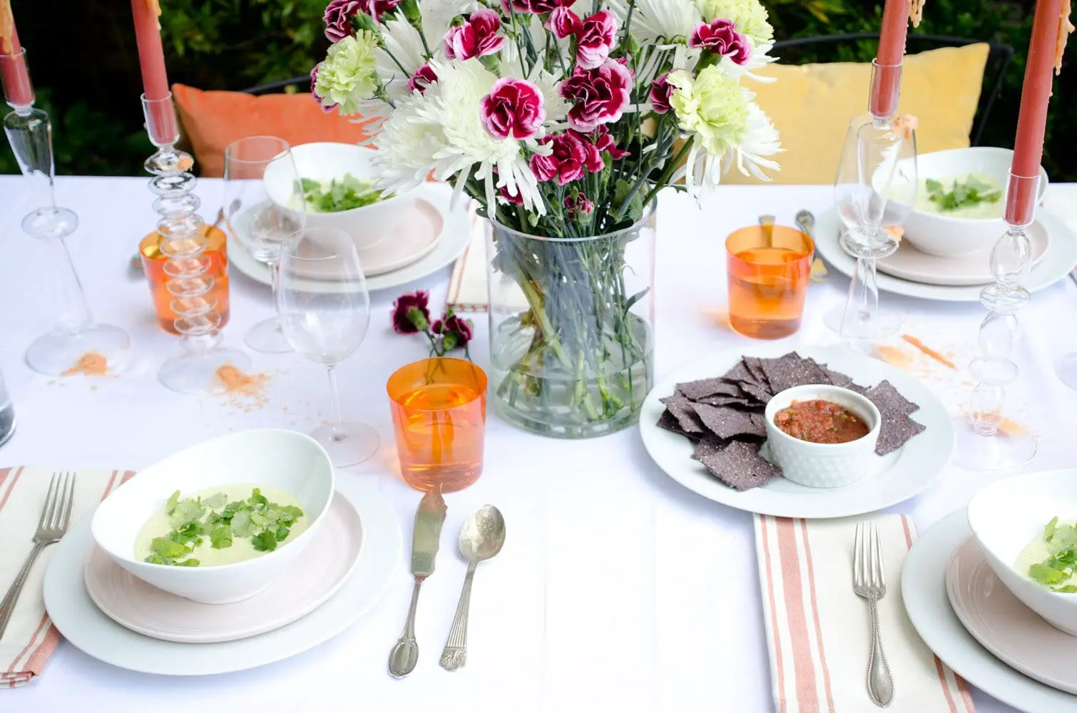 Brighten up your Cinco de Mayo tabletop with pops of orange, yellow and blush, and bring in colored water glasses and striped napkins for some pizazz.