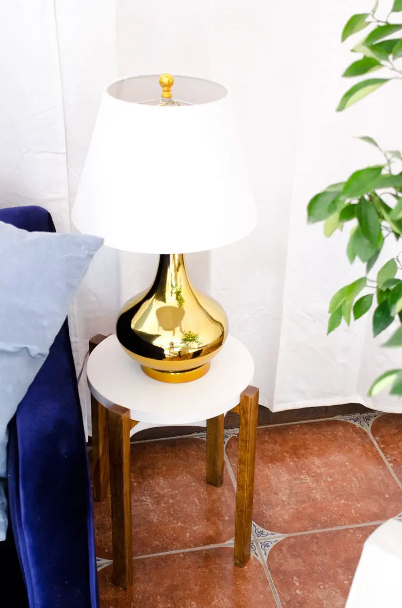 Modern side table and gold table lamp.
