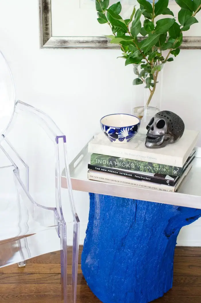 A bold blue DIY painted stump side table.