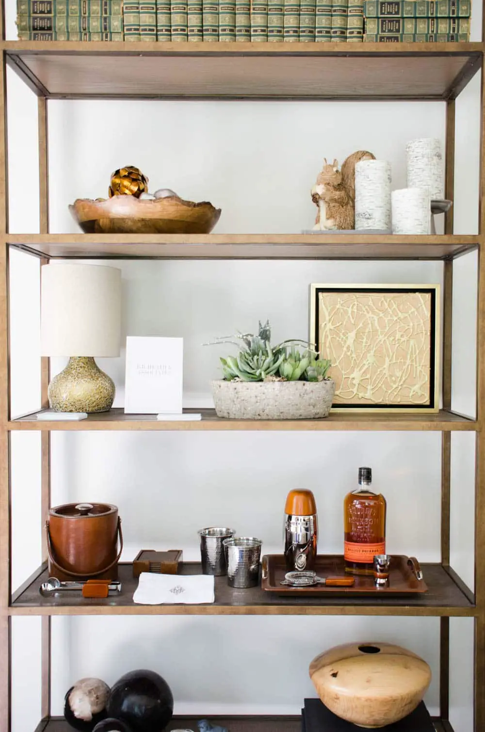 Shelf styling with mini-bar and books