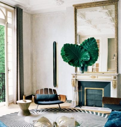 A sophisticated modern living room in an ornate Parisian apartment on Thou Swell #parisapartment #paris #france #frenchapartment #frenchhome #hometour #interiordesign #luxurydesign
