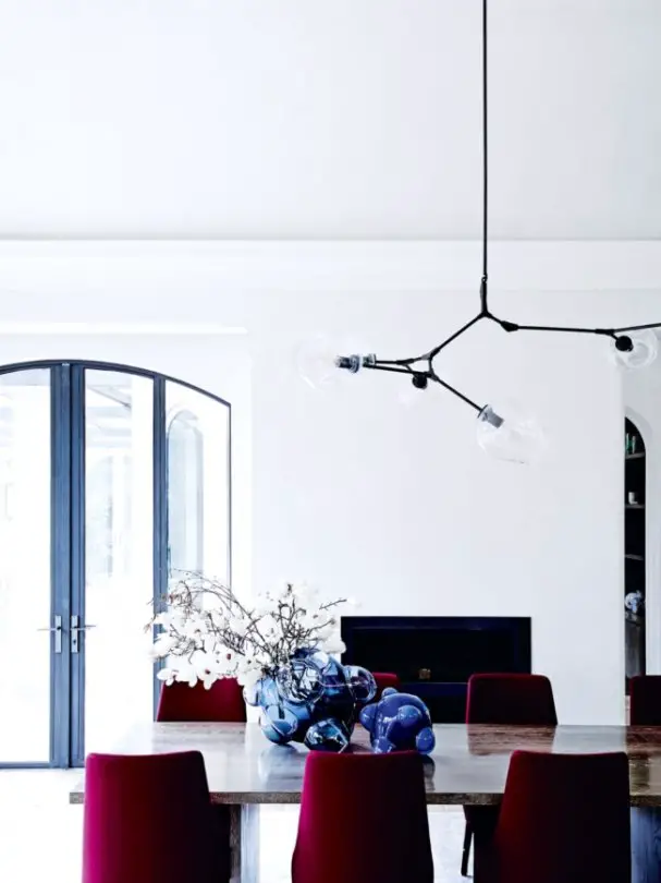Modern dining room with burgundy chairs in a white and blue Melbourne home on @thouswellblog