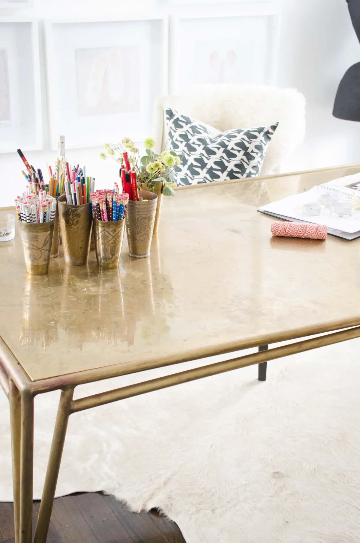 Modern feminine office with brass desk and gallery wall on @thouswellblog