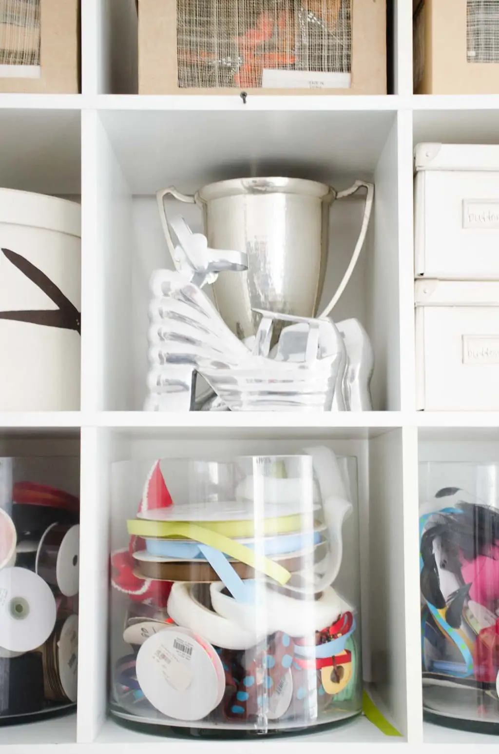 Organized shelves in a home office on @thouswellblog