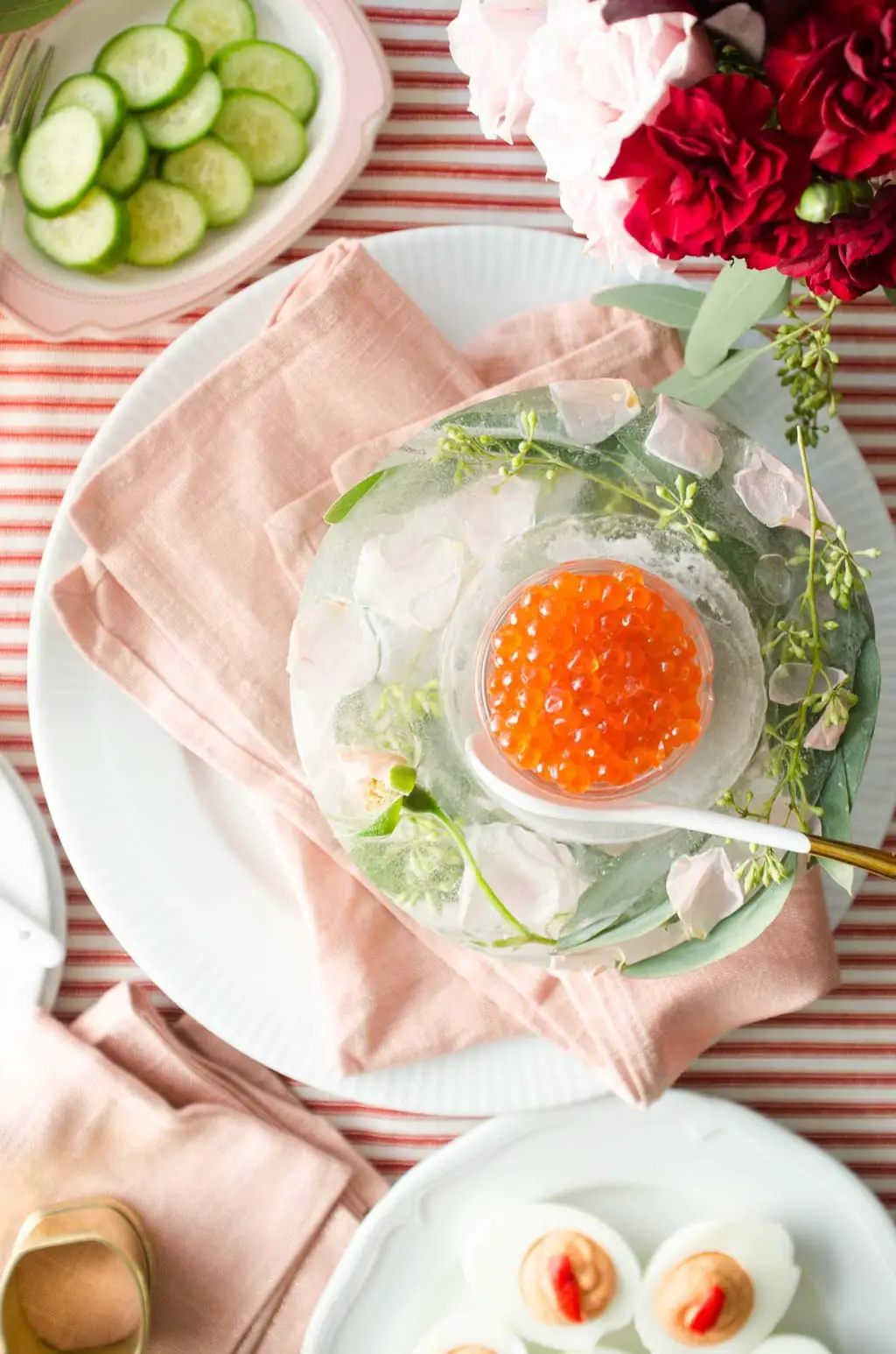Salmon roe and floral ice bowl Valentine's Day appetizer party table via @thouswellblog