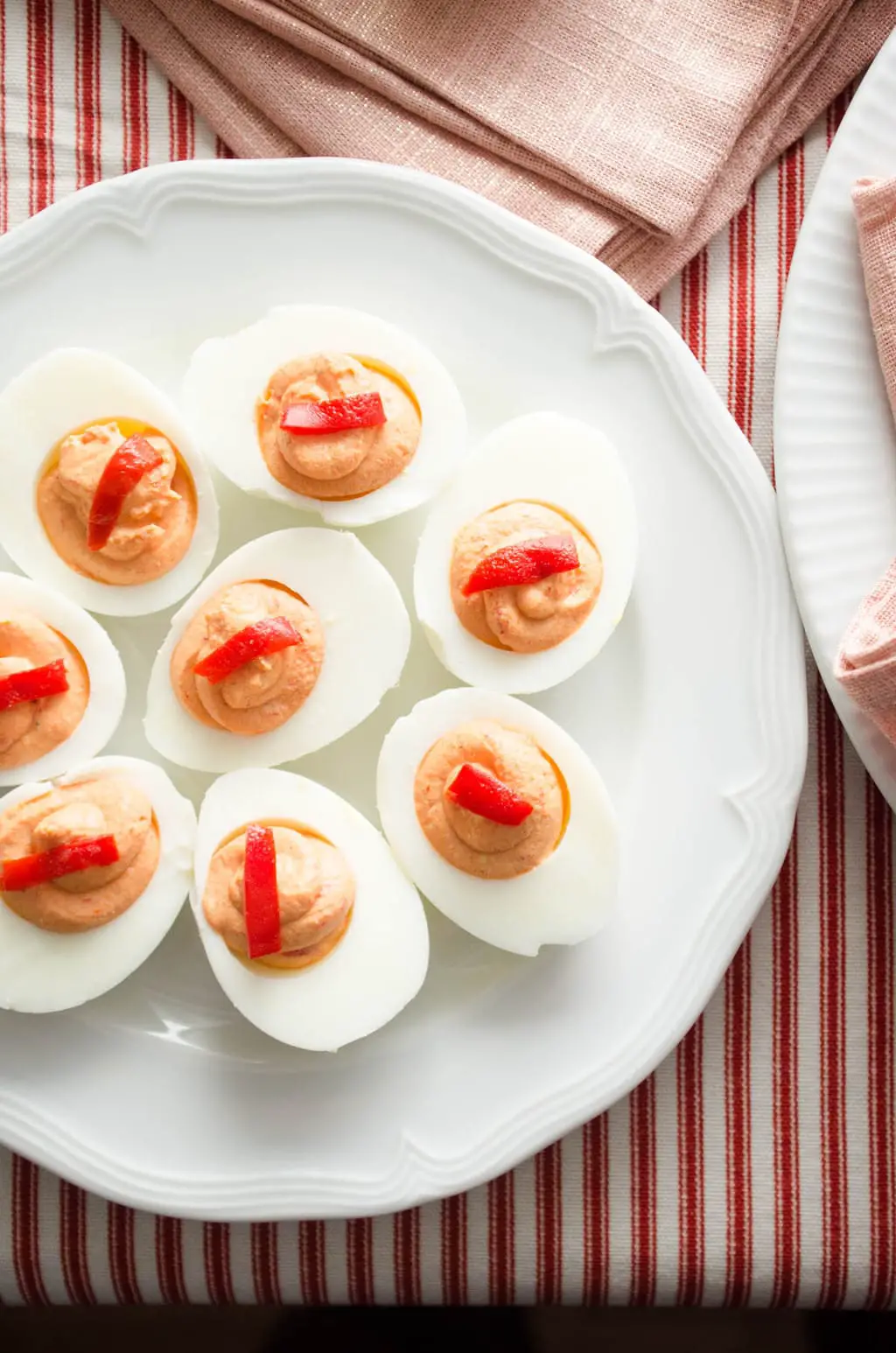 Roasted piquillo pepper deviled eggs via @thouswellblog