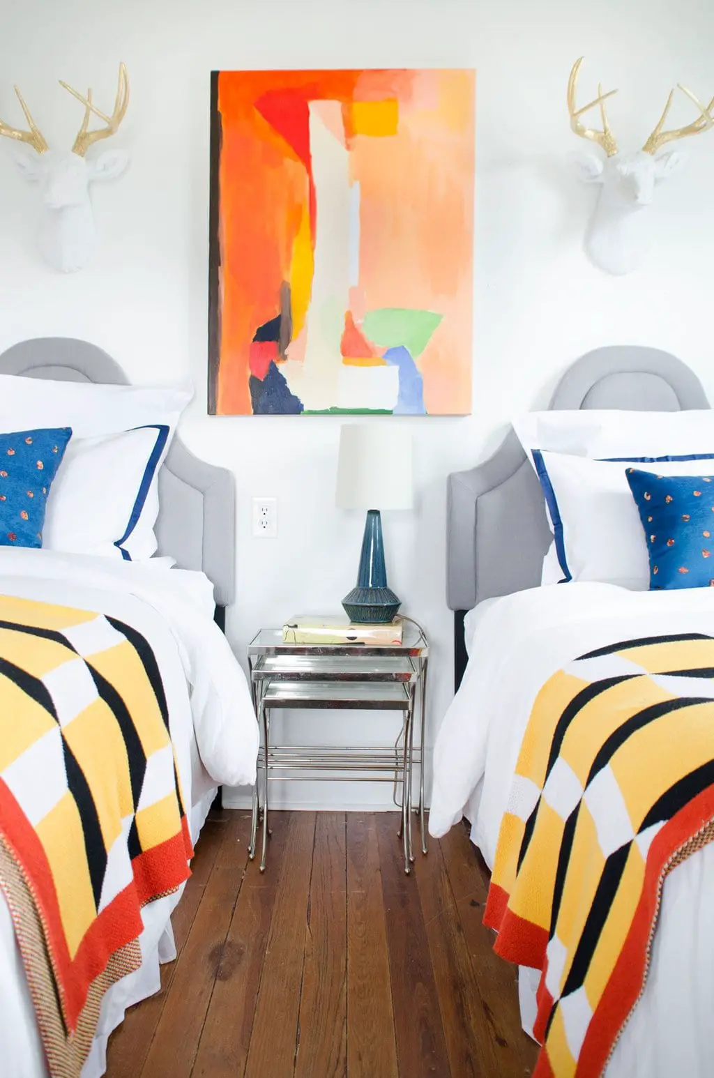 Colorful bedroom makeover with faux taxidermy and graphic accessories via @thouswellblog