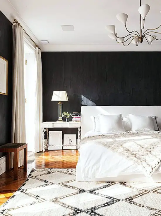 Neutral bedroom with black walls and Moroccan rug via @thouswellblog