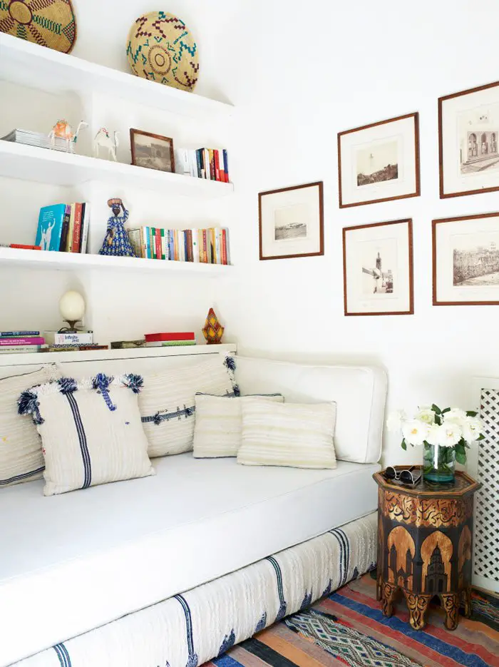 Moroccan day bed with gallery wall and open shelves on @thouswellblog