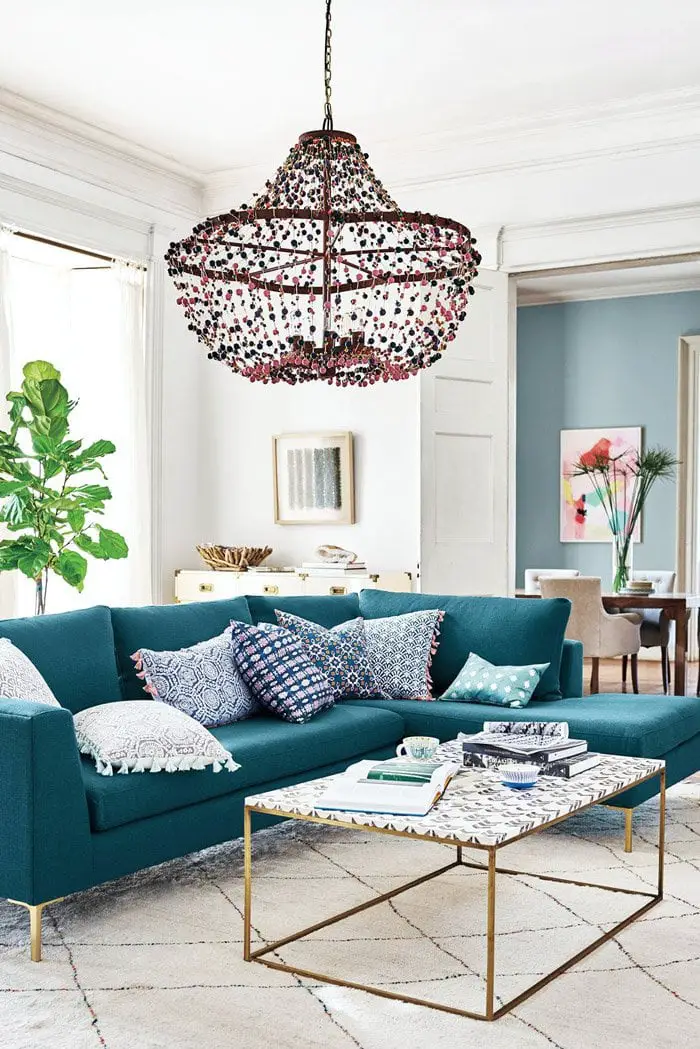 Living room with beaded chandelier and tassel home decor via @thouswellblog