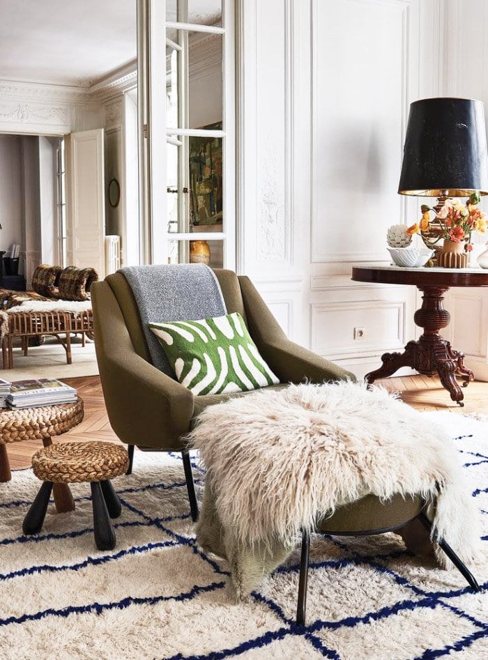 Modern armchair with sheepskin and Moroccan rug via Thou Swell #chloe #france #paris #frenchdesign #hometour #apartmenttour #interiordesign #livingroom #homedecor