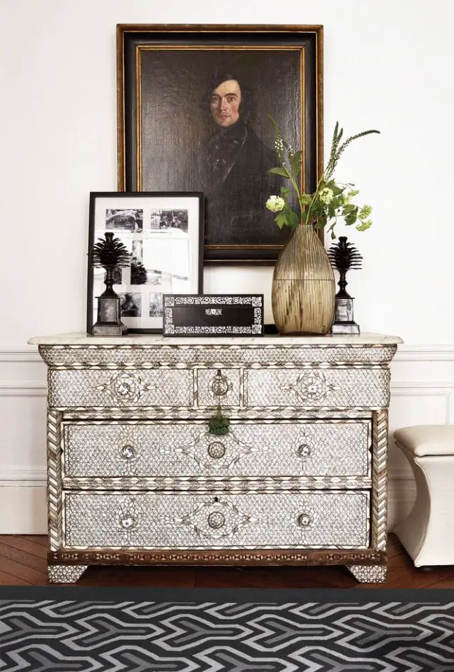 Vintage dresser and oil painting in Parisian apartment via @thouswellblog