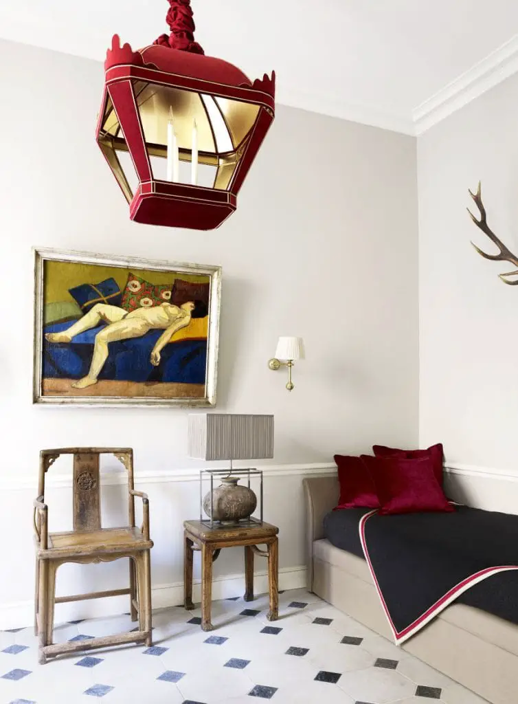 Red lantern and daybed in a glamorous Paris apartment via Thou Swell #paris #parisapartment #parisdesign #luxurydesign #luxuryapartment #luxury #interiordesign