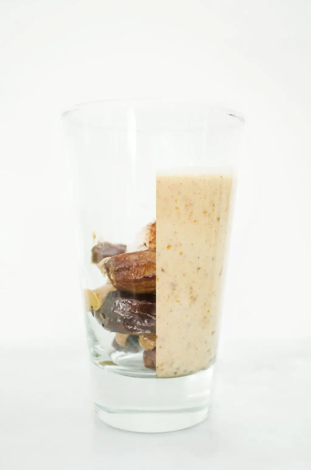 Creamy almond smoothie with dates, almond butter, coconut butter, cinnamon, and Truvia nectar via @thouswellblog