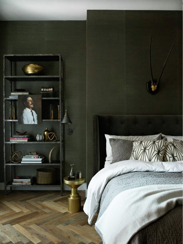 Dark green bedroom walls in a moody masculine Soho loft on Thou Swell #greenbedroom #greenwalls #bedroom #bedroomdesign #homedecor #homedesign #interiordesign