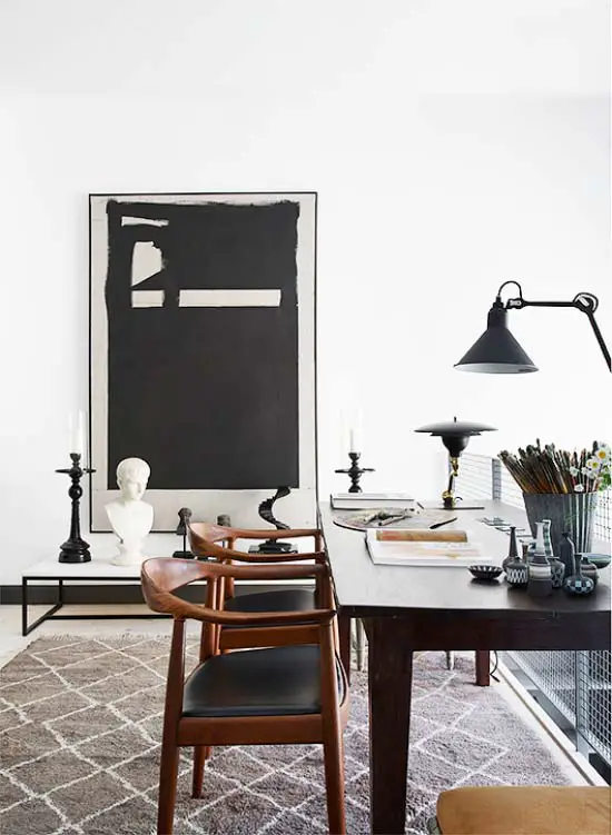 Black and white home office with large artwork via Thou Swell