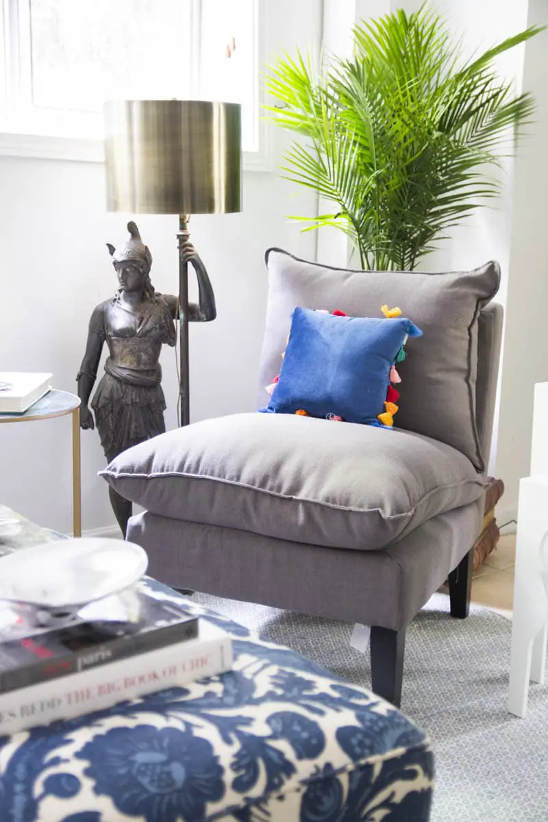 Grey accent chair and palm with floor lamp and brass lampshade on Thou Swell