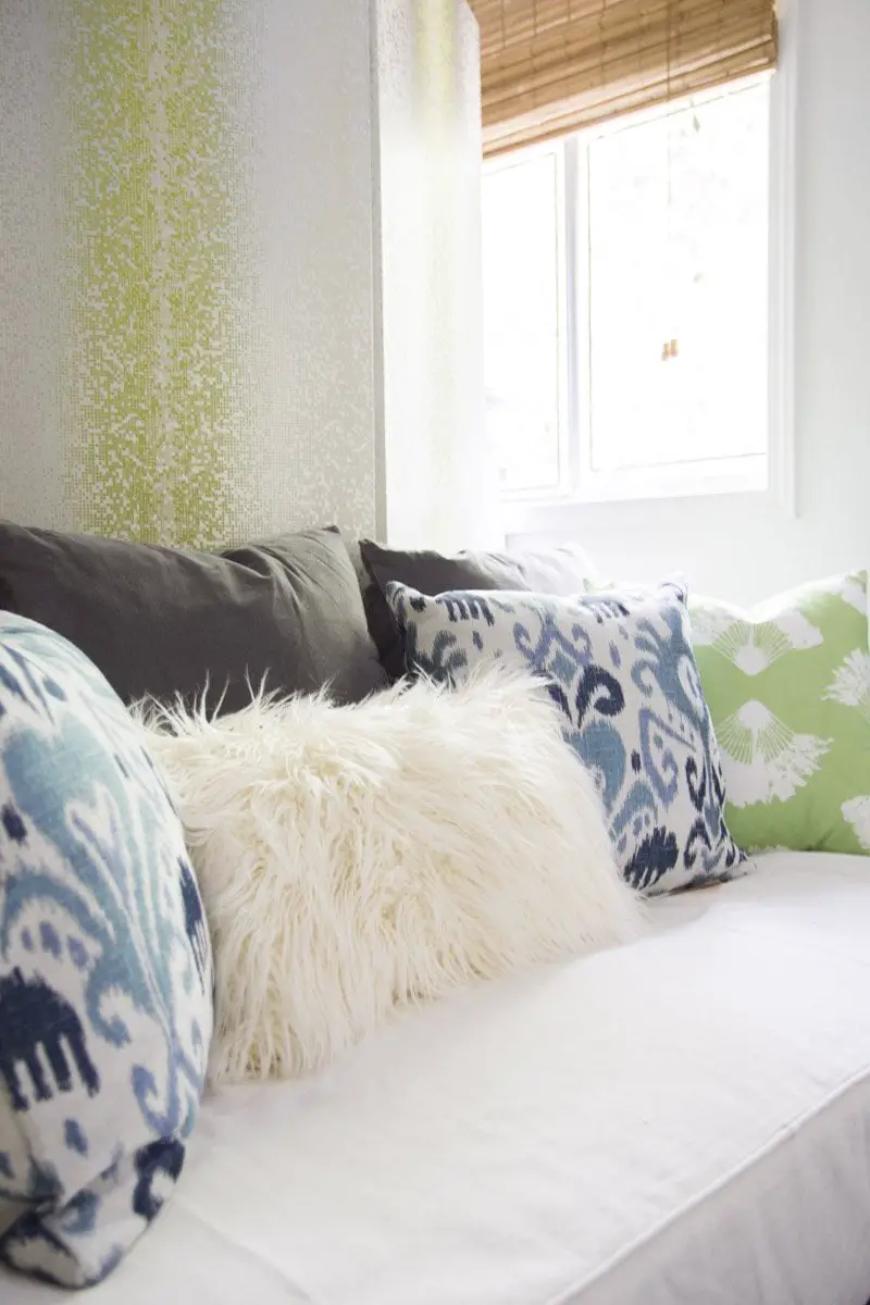 Bohemian daybed with blue and green throw pillows on Thou Swell