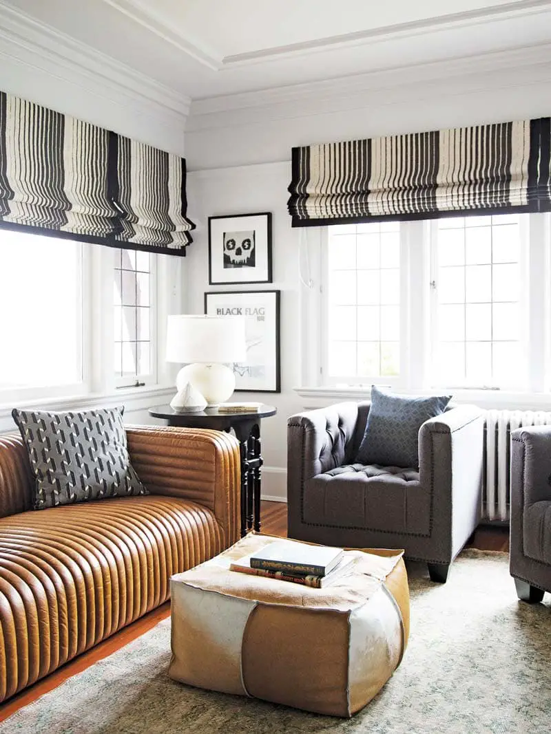 Living room with leather channel tufted sofa on Thou Swell @thouswellblog