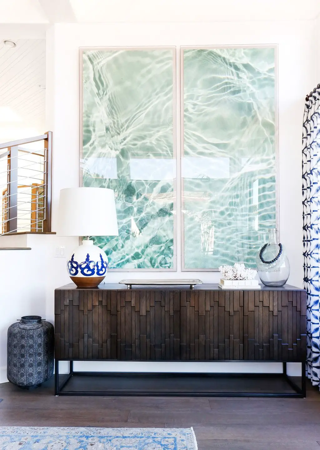 Blue water diptych artwork in coastal beach living room on Thou Swell @thouswellblog