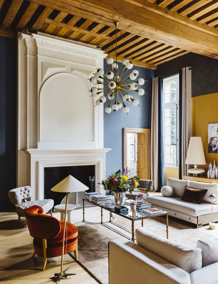 Elegant living room with mix of modern and antique furniture on Thou Swell #paris #parishome #hometour #france #frenchdesign #interiordesign