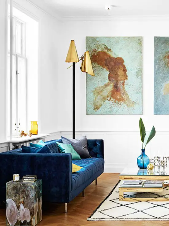 Modern blue velvet tufted sofa in Scandinavian living room on Thou Swell @thouswellblog