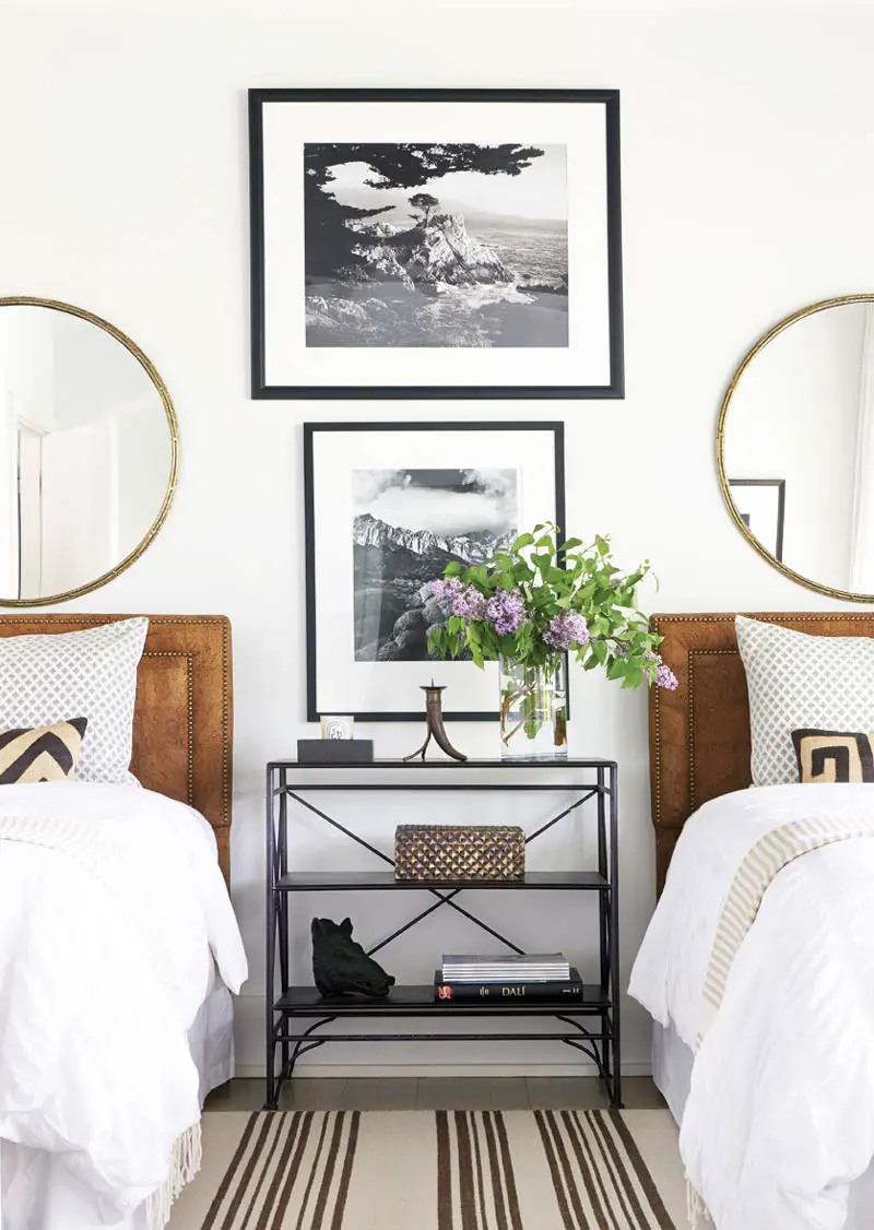Layered twin bedroom design with round mirrors and console table via Thou Swell @thouswellblog
