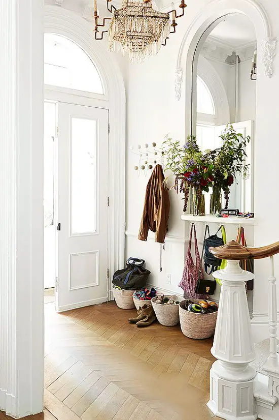 Traditional entry hall with wicker basket storage and mirror on Thou Swell @thouswellblog