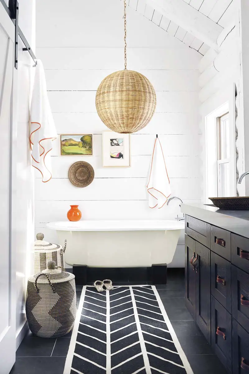 Playful bathroom design with wicker pendant and decorative baskets on Thou Swell @thouswellblog