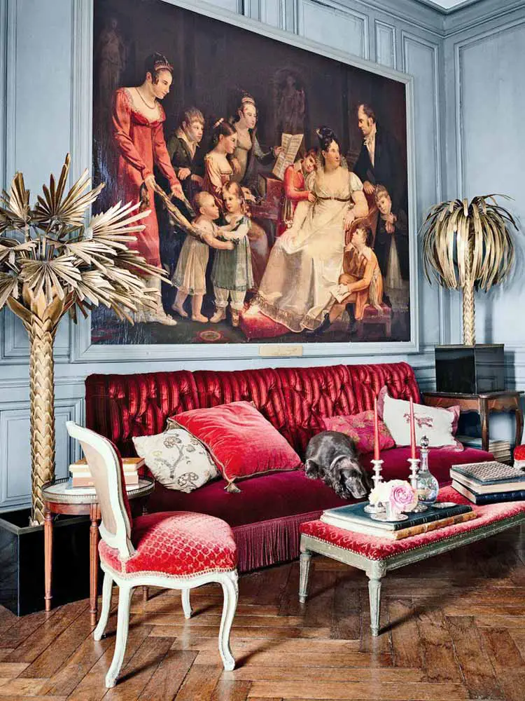 Chateau living room with red velvet sofa and Maison Jansen brass palm tree lamps on Thou Swell @thouswellblog