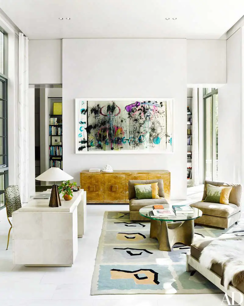 Modern lake house living room with fine art collection on Thou Swell @thouswellblog
