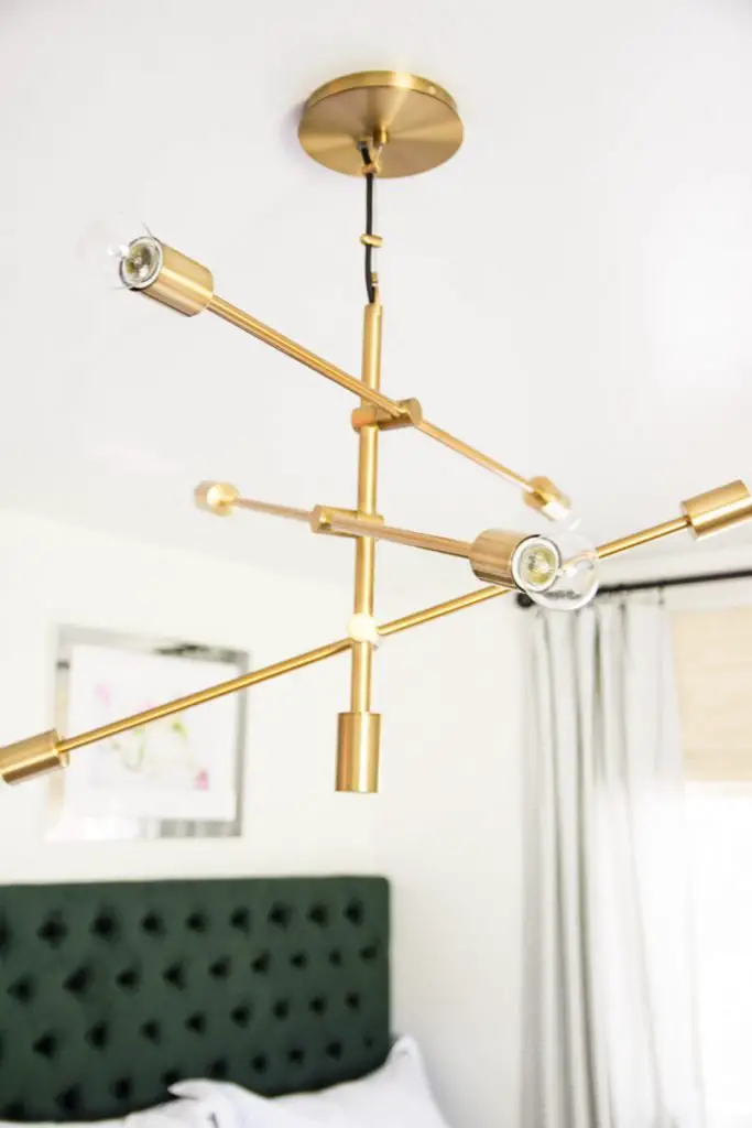 Pretty gold mobile chandelier from west elm on Thou Swell @thouswellblog