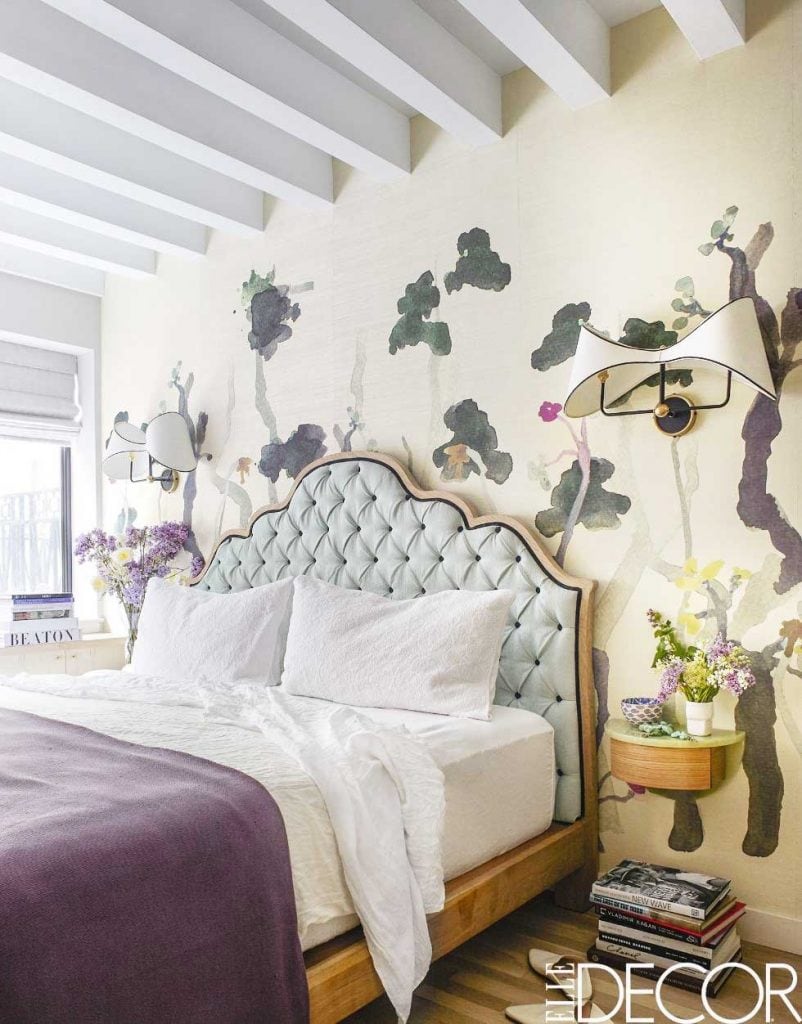 Colorful floral bedroom decor with custom wallpaper, tufted blue headboard, and spring home decor on Thou Swell #bedroom #bedroomdesign #mural #wallmural #floralbedroom #floraldesign #floralmural #wallpaper #westvillage #homedecor