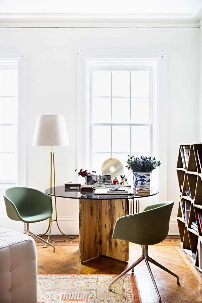 Raw wood dining table with modern green dining chairs in Manhattan on Thou Swell @thouswellblog