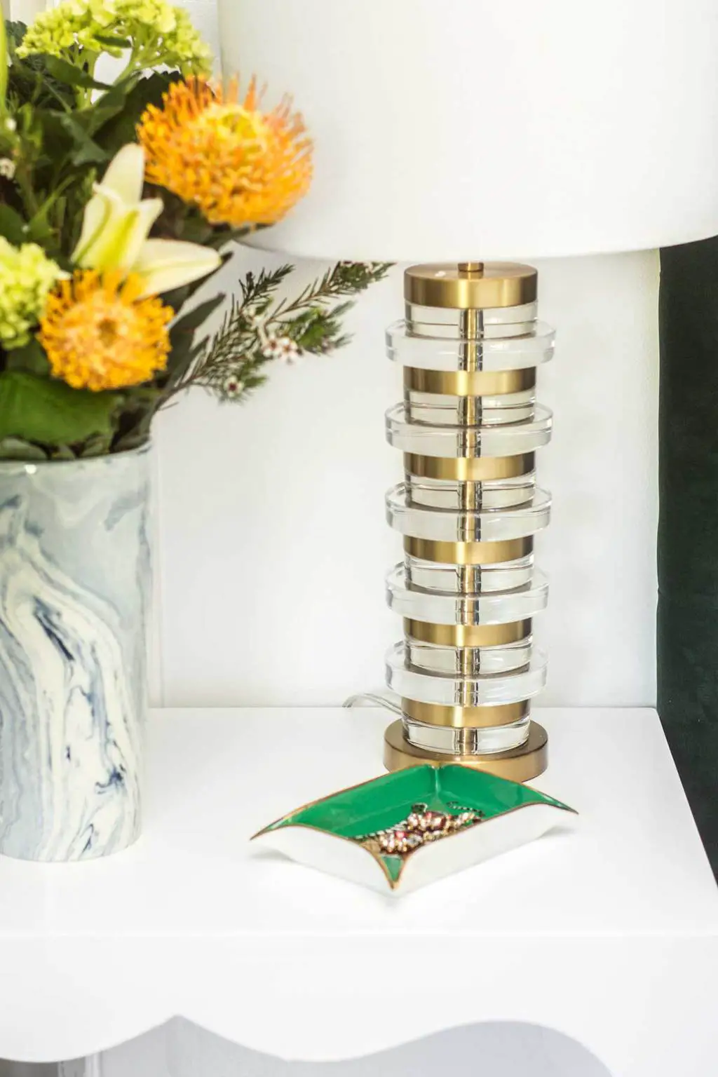 Brass table lamp and blue marbleized vase on bedside table via Thou Swell @thouswellblog