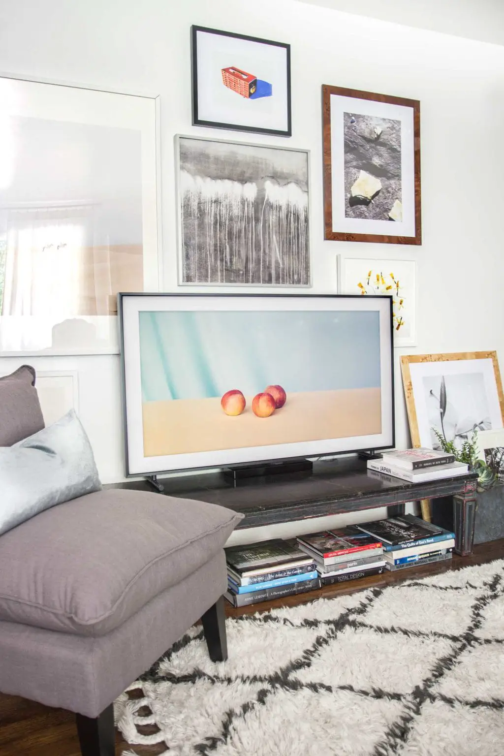 Framed TV screen with gallery wall and curated art selection for The Frame by Samsung on Thou Swell @thouswellblog