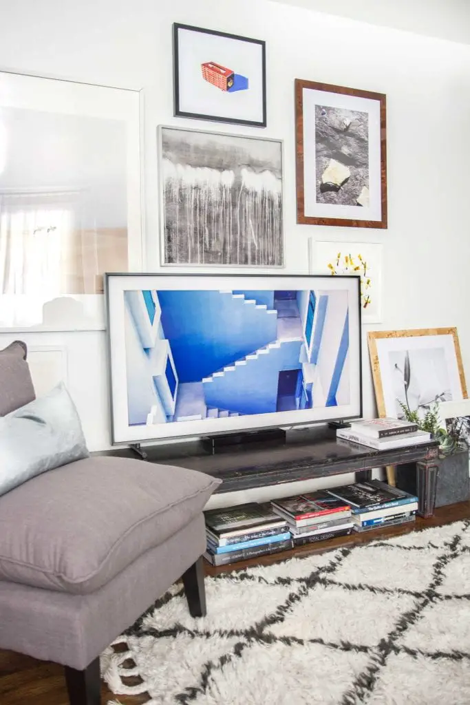 Framed TV screen with gallery wall and curated art selection for The Frame by Samsung on Thou Swell @thouswellblog