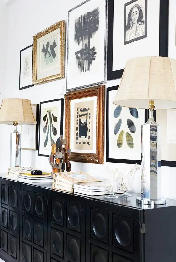 Black console with mirrored silver table lamps and gallery wall in Malene Birger's home on Thou Swell @thouswellblog