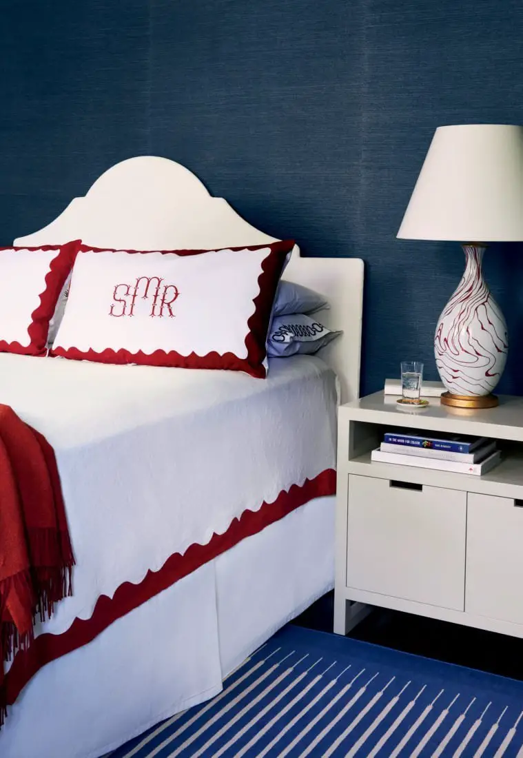 Traditional blue bedroom with grasscloth wallpaper and red monogram bedding on Thou Swell @thouswellblog