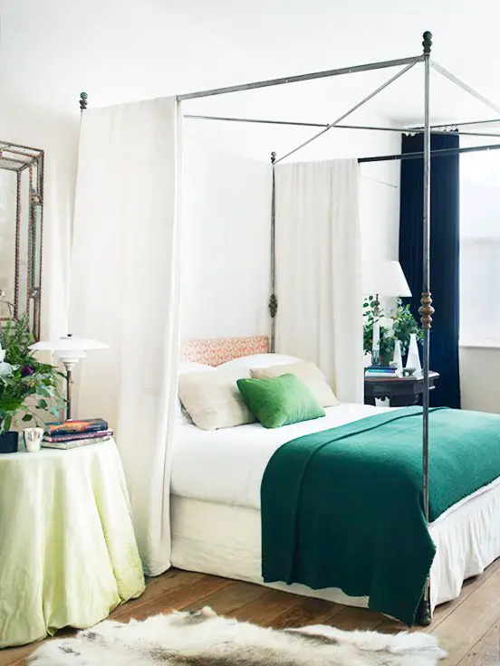 Metal canopy bed with green throw in a neo-traditional bedroom by Rose Uniacke on Thou Swell @thouswellblog