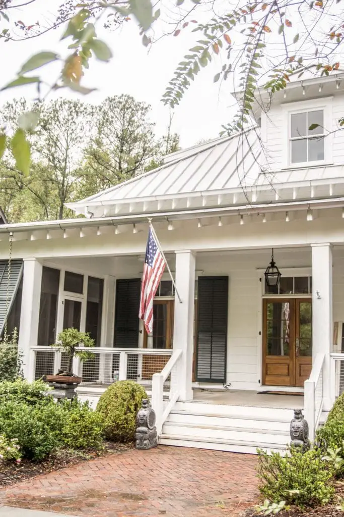 Front porch with shutters and tin roof in Serenbe, Georgia on Thou Swell @thouswellblog