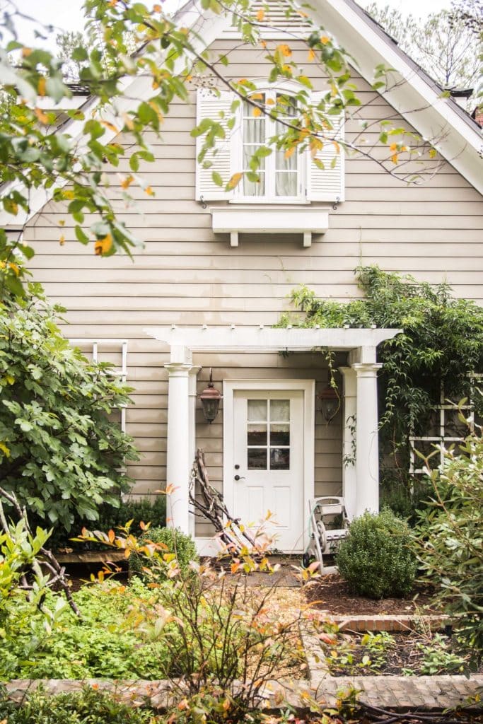 Clapboard house with side garden in Serenbe, Georgia on Thou Swell @thouswellblog