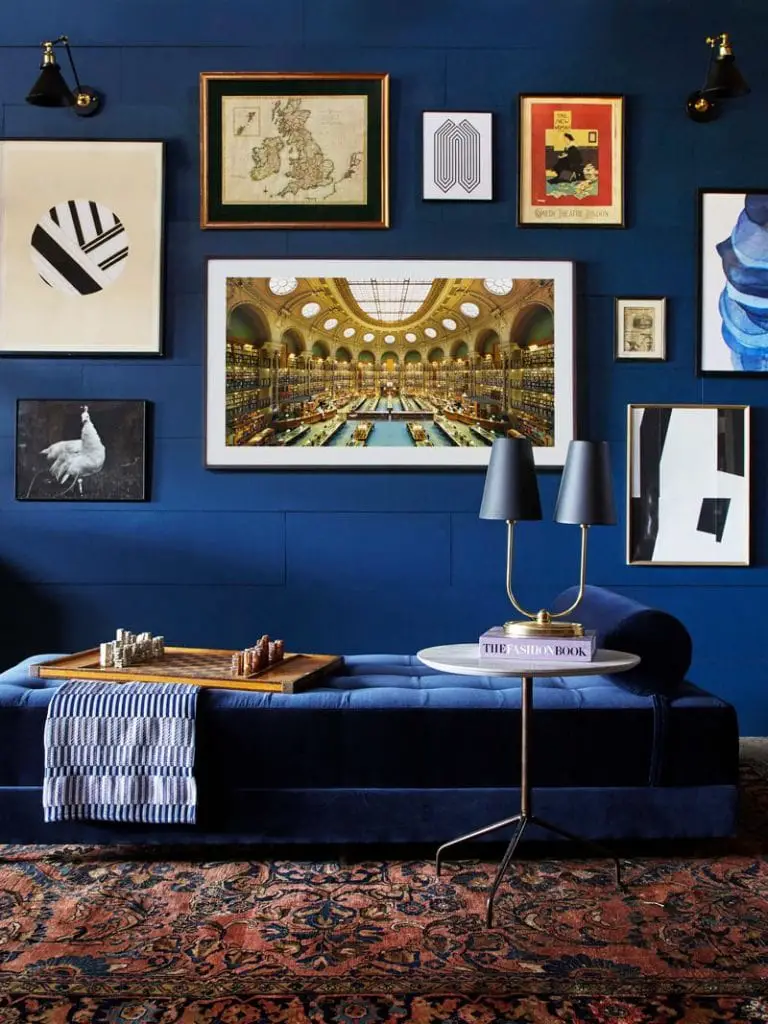 Dark blue library walls with gallery wall and velvet daybed on Thou Swell @thouswellblog