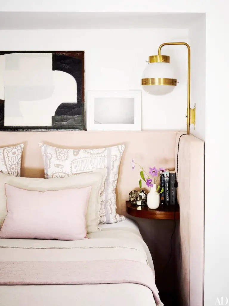 Modern blush bedroom with brass sconces in Los Angeles on Thou Swell @thouswellblog