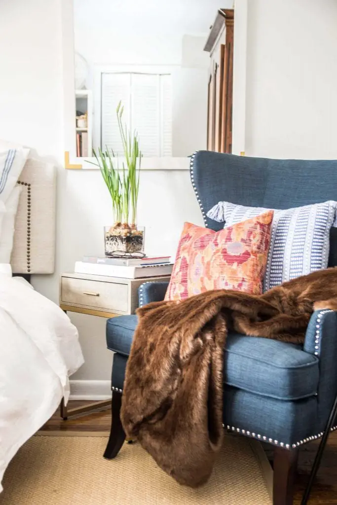 Blue wingback accent chair in a white neo-traditional bedroom on Thou Swell @thouswellblog