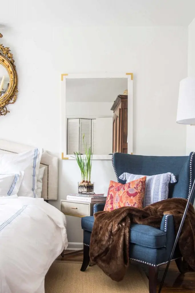 Blue wingback accent chair in a white neo-traditional bedroom on Thou Swell @thouswellblog