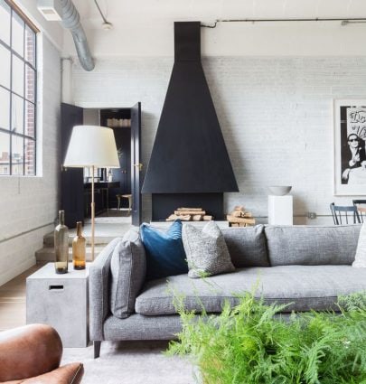TOUR AN URBAN LOFT IN WASHINGTON D.C. 4 Modern D.C. loft with custom oversized chimney hood in living room on Thou Swell @thouswellblog