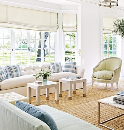 REFRESHING STYLE FOR A HOUSTON MANSION 7 Bright blue and green living room with sisal carpet and traditional style in a Houston mansion on Thou Swell @thouswellblog