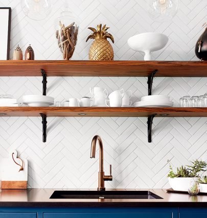 Pineapple decor in a French kitchen with blue cabinets and open shelving on Thou Swell @thouswellblog