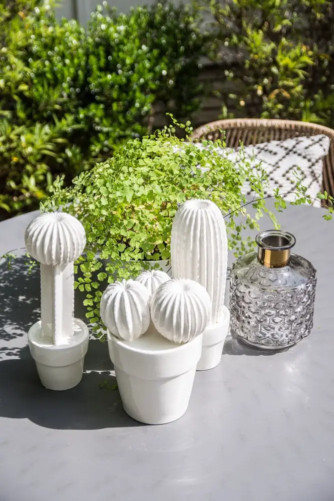 Dining table accessories with ceramic cacti and fern on Thou Swell @thouswellblog